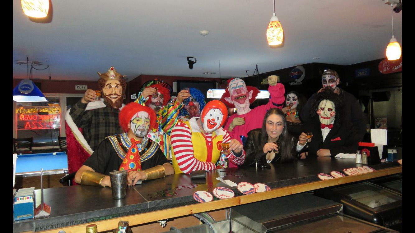 Public social-event group photo with guests and event participants.