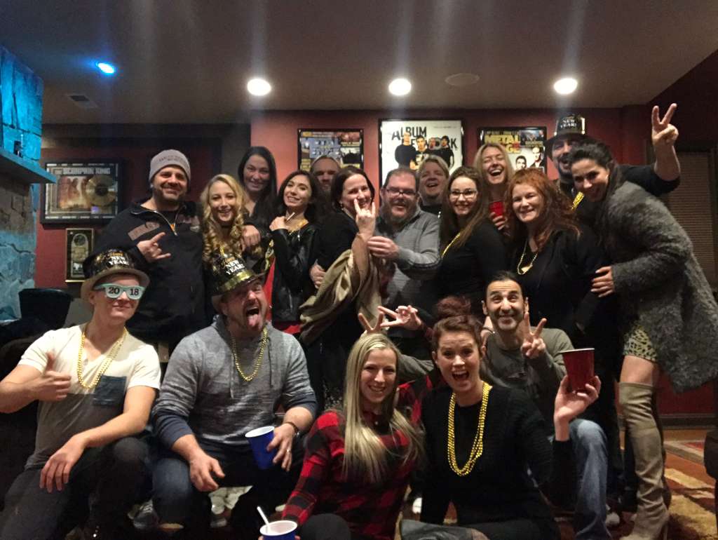 Public social-event group photo with guests and event participants.