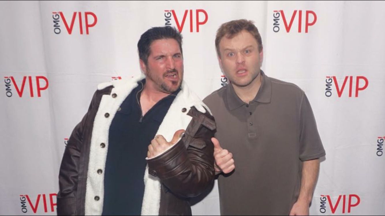 VIP entertainment event photo with performers and guests.