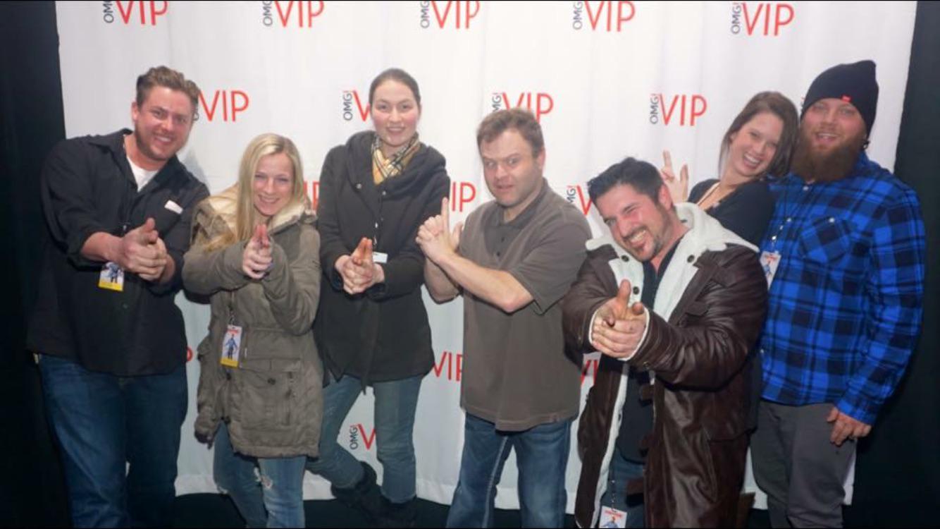 VIP entertainment event photo with performers and guests.